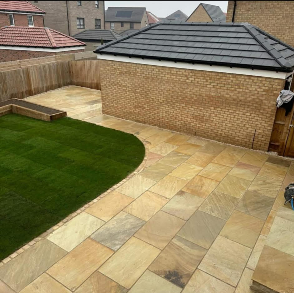 Contemporary garden with paving and artificial grass